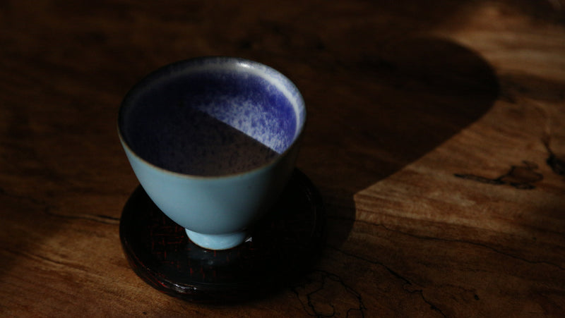 Blue glaze cup inset with silver flower