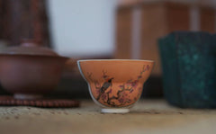 Handmade and hand painted wood fired bird and plum blossom cup